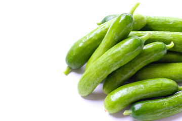 Fresh mini baby cucumbers on white background