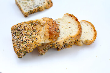 Sliced multigrain bread topped with pumpkin seeds, sunflower seeds, sesame, and black sesame.