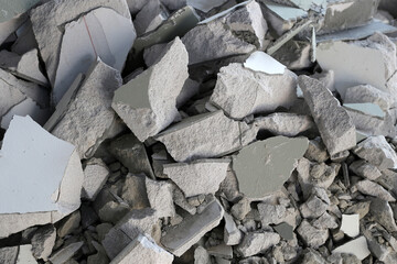 Broken concrete, Piles of lightweight construction bricks after house demolition