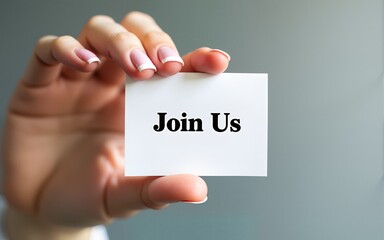 Hand holding a card with 'Join Us' message, emphasizing recruitment, teamwork, and inclusivity. Perfect for business and community outreach projects. High quality
