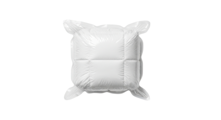 Top-down view of a new white square cushion compressed in a shiny, clear vacuum storage bag, showing the wrinkled plastic and soft, puffy textile