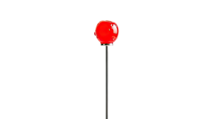 A single glossy red maraschino cherry with a shiny glaze is elegantly presented on a thin metal cocktail pick in a minimalist and dramatic composition