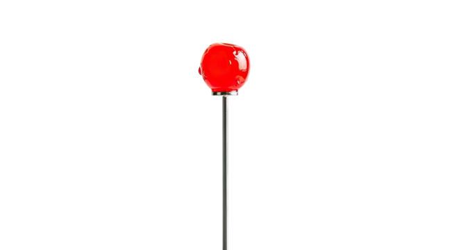 A single glossy red maraschino cherry with a shiny glaze is elegantly presented on a thin metal cocktail pick in a minimalist and dramatic composition