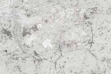Concrete grunge wall texture with peeling paint and cracks