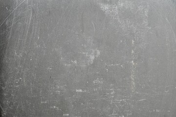 Naklejka premium Light grey concrete wall with subtle distress marks and natural wear, making it a versatile industrial or architectural background.