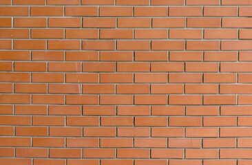 Orange brick wall texture with clean horizontal alignment, ideal for architectural backgrounds, construction themes, and interior design references.