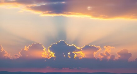 Dramatic sunset sky with sun rays bursting through dark clouds