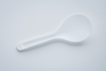 Closeup of a rice paddle spoon, commonly used to scoop steamed rice.