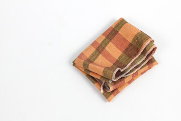 Folded Woven Plaid Kitchen Napkin Textile Detail on White Background