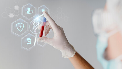 Close up of a gloved hand touching a futuristic holographic interface displaying medical icons and a blood sample vial