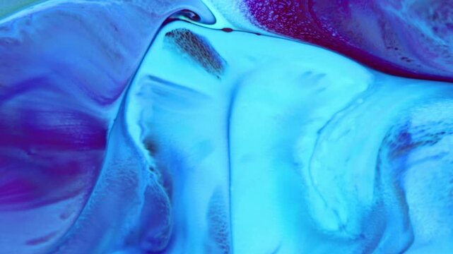 This stock footage features an extreme close-up shot of a colorful liquid paint abstract. It is a beautiful texture design created using a variety of colors