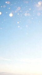 Clear blue sky with soft bokeh light effects and gentle gradient from blue to white