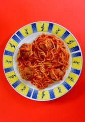 Delicious spaghetti and meatballs on a plate.
