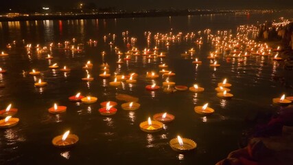 Candlelight vigil illuminates river waters at night during a cultural festival, creating a powerful atmosphere of remembrance and hope for the future - Powered by Adobe
