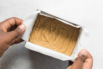 Brown sugar fudge slab on a marble tray, caramel fudge candy on a marble tray