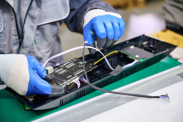 PCB assembly process inside a plastic housing during electronics manufacturing with precision and care