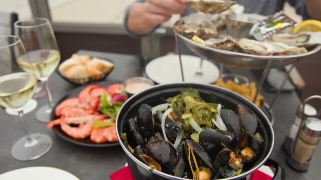 Serving Fresh Seafood Platter at Beachside Restaurant in Dunkirk