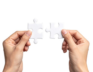 Hands connecting two white jigsaw puzzle pieces for a teamwork solution isolated on white and transparent background