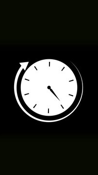 Minimalist white analog clock with moving arrow showing time progression on dark surface. Vertical mobile video White Clock with Arrow Indicating Time Movement on Black Background.