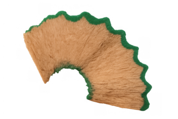 Pencil shaving with green lead waste forming a spiral shape, representing education, art, and creative process