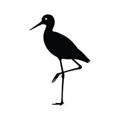 Black silhouette of a wading bird standing on one leg shorebird