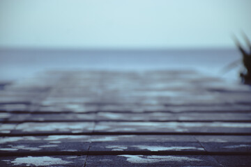 brown wooden deck by the beach