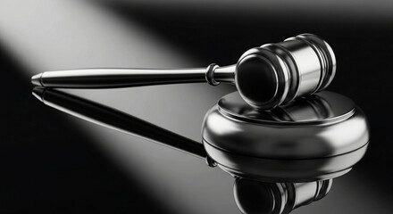 Dramatic gavel resting on block reflecting in polished surface perfect for legal themes, courtroom dramas, and justice system advertising campaigns