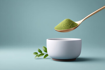 Green matcha powder falls into white bowl creating zen stillness