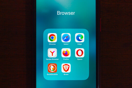 Quito, ECUADOR - Oct 6 2025 :Smartphone screen showing web browser app icons for Chrome, Safari, Edge, Yandex, Firefox, Opera, DuckDuckGo and Brave.