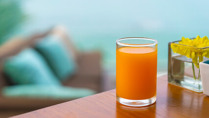 Refreshing orange juice served as a welcome drink at a luxury hotel or tropical resort, with soft-focus background, ideal for travel promotions, hospitality concepts, and relaxation themes.