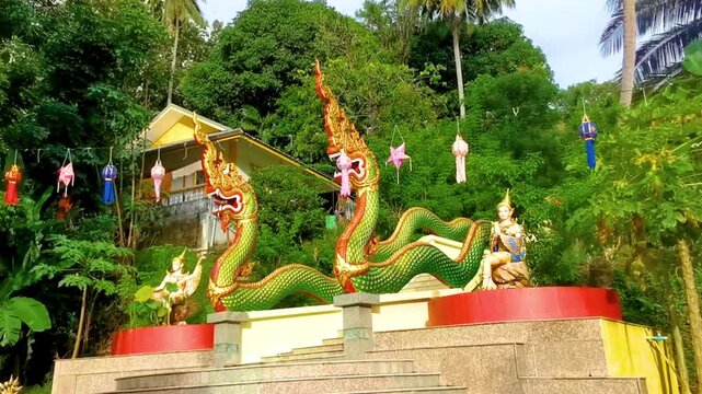 Suwankeereewong Temple green naga statue statues sculpture sculptures stairs Thailand.