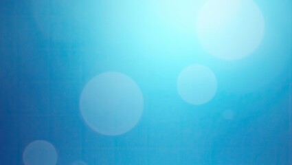 Soft, dreamy image displays a gradient of blue hues, transitioning from deeper tones to brighter whites and features ethereal, out-of-focus circles adding depth, with the top right portion...