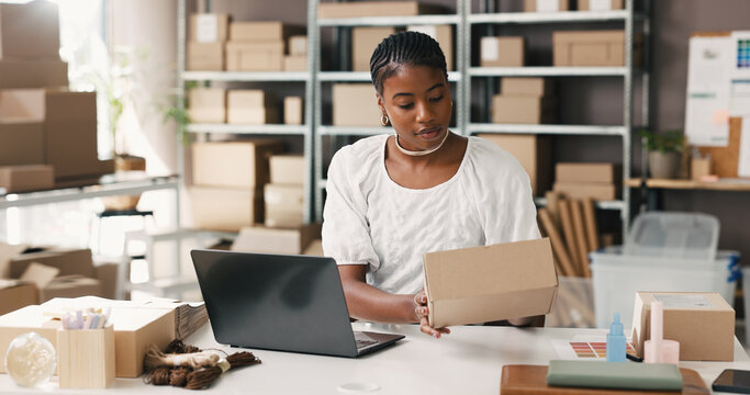 Black woman, laptop and logistics with box for small business startup or delivery schedule in store. Female person, distributor or supplier with parcel, package or computer for safe courier service
