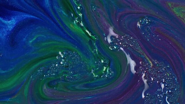 Seamless loop of an otherworldly, abstract landscape formed by undulating waves of shimmering, metallic hued liquid under soft, diffused lighting. Wide shot revealing the expansive, rolling?