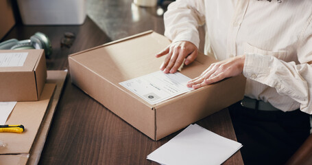 Hands, person and box label for ecommerce, shipping information and distribution. Package, sticker...