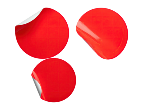 Three red round stickers, corner peeled