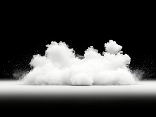 A dense cloud of white powder explodes upwards and outwards, scattering fine particles against a dark background.