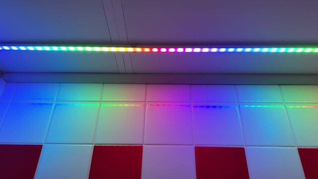The LED strip in the kitchen works in automatic multi-color rgb light mode and shines in a variety of colors