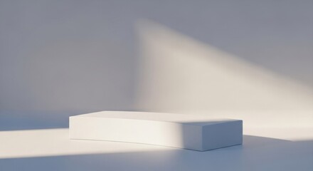 Minimalist white rectangular plinth in bright sunlight with sharp geometric shadows