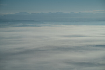 Fototapeta premium Sea of clouds spreading over Nayoro, Hokkaido on a minus twenty degrees winter morning, creating a breathtaking and serene atmospheric landscape above the frozen land