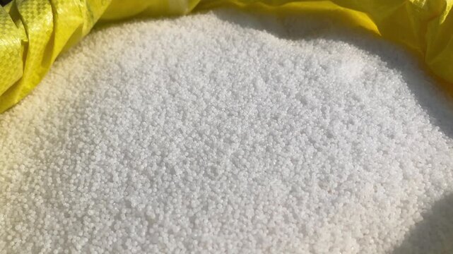 Closeup of White Urea Fertilizer Granules in 4K Horizontal Video