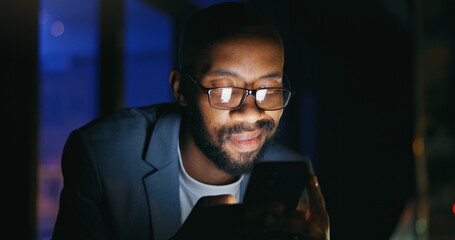 Typing, night and black man on balcony with phone, online communication and good news on email....