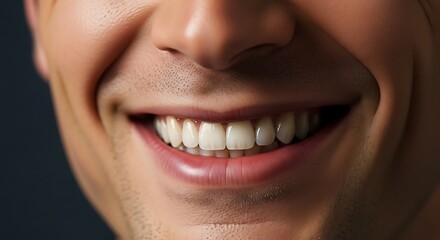 A detailed close-up of an attractive man's perfect smile, featuring clean, white, and straight teeth that showcase excellent dental health and happiness