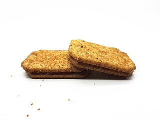 Two delicious rectangular sandwich cookies stacked on a white surface