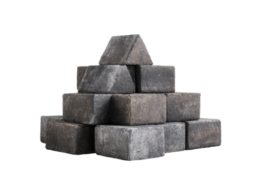Stacked grey pavement bricks on a dark background