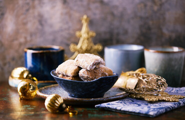 Traditional christmas cookies in a bowl on a rustic wooden background. Soft focus.	
