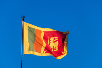 Sri Lankan Flag Waving in the Wind Against a Clear Blue Sky