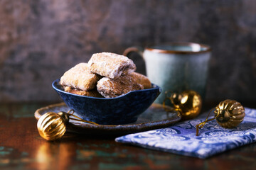 Traditional christmas cookies with gingerbread in a bowl on a rustic wooden background. Soft focus.	