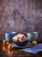 Traditional christmas cookies in a bowl on a rustic wooden background. Soft focus.	
