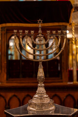 Elegant menorah shines in synagogue symbolizing Jewish heritage tradition spiritual celebration